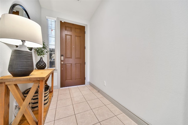 28111 Middlewater View Ln, Katy, TX 77494 - entryway featuring light tile patterned floors, vaulted ceiling, and baseboards