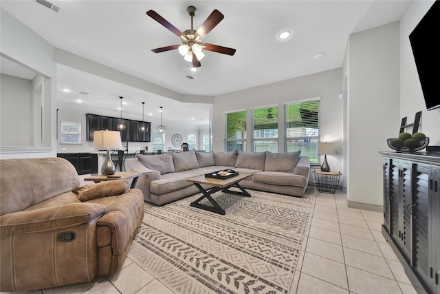 28111 Middlewater View Ln, Katy, TX 77494 - living room featuring light tile patterned floors, a ceiling fan, and recessed lighting