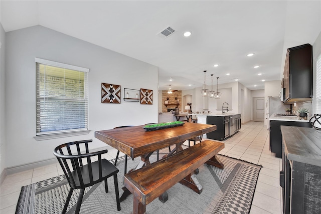 28111 Middlewater View Ln, Katy, TX 77494 - dining space with light tile patterned floors, recessed lighting, baseboards, and vaulted ceiling