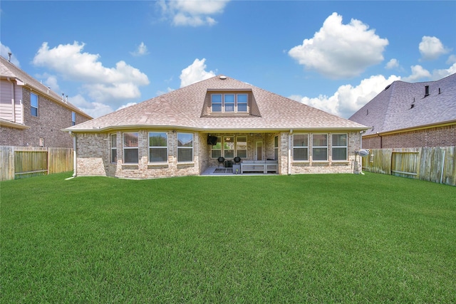 28111 Middlewater View Ln, Katy, TX 77494 - back of property with brick siding, a patio, and roof with shingles