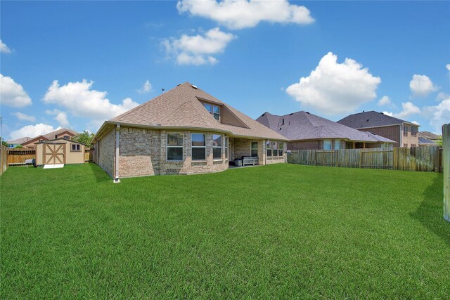 28111 Middlewater View Ln, Katy, TX 77494 - rear view of house featuring brick siding and roof with shingles