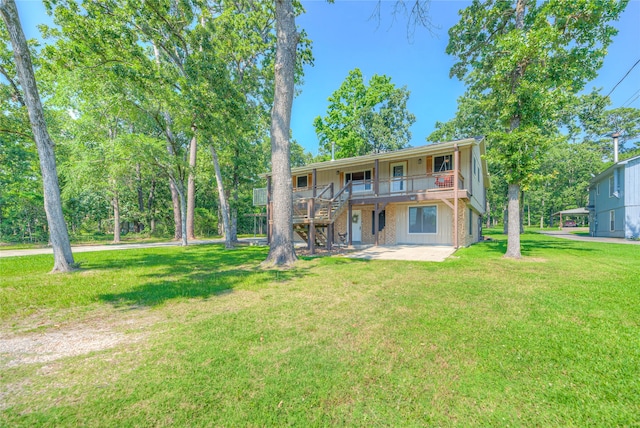 517 Lakeview Hbr, Onalaska, TX 77360 - back of property with a lawn, a patio, stairway, and a deck