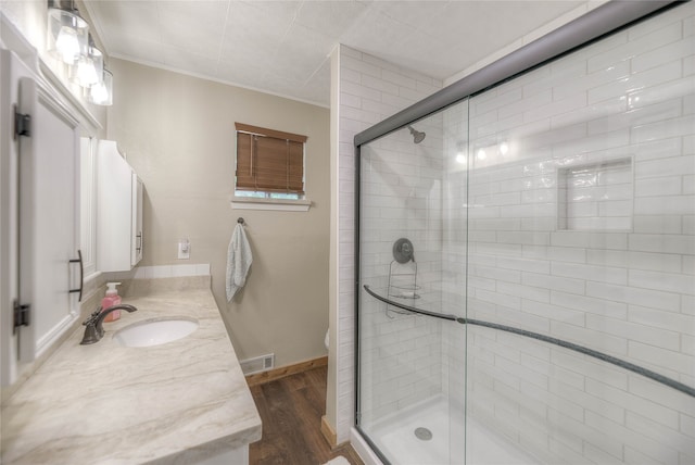 517 Lakeview Hbr, Onalaska, TX 77360 - full bathroom featuring wood finished floors, a shower stall, vanity, crown molding, and toilet