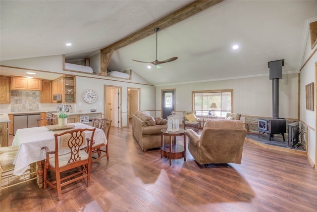 517 Lakeview Hbr, Onalaska, TX 77360 - living room with a ceiling fan, beam ceiling, a wood stove, wood finished floors, and high vaulted ceiling