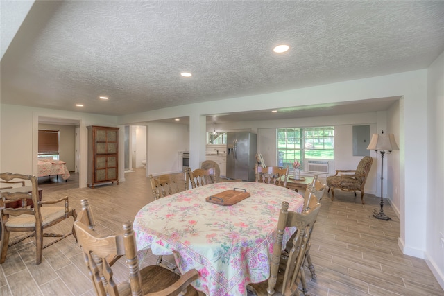 517 Lakeview Hbr, Onalaska, TX 77360 - dining room with wood finish floors, a textured ceiling, baseboards, and recessed lighting