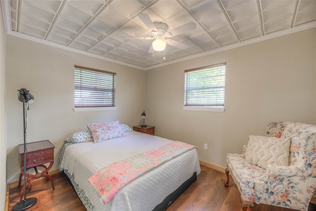 517 Lakeview Hbr, Onalaska, TX 77360 - bedroom featuring multiple windows, ornamental molding, dark wood finished floors, baseboards, and a ceiling fan