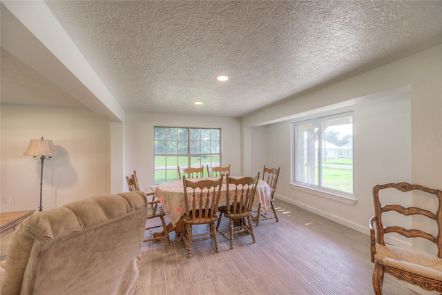 517 Lakeview Hbr, Onalaska, TX 77360 - dining room featuring a textured ceiling, wood finished floors, recessed lighting, and baseboards