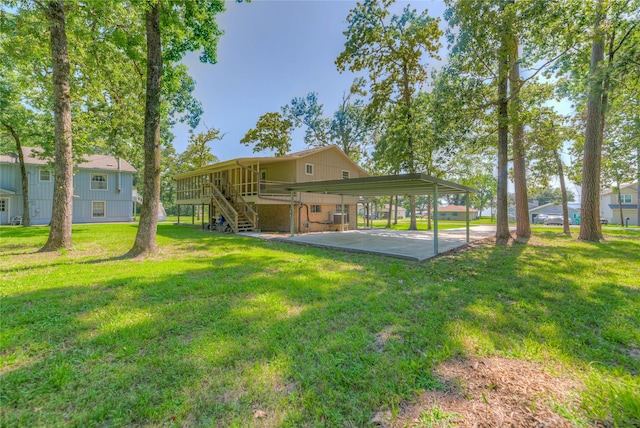 517 Lakeview Hbr, Onalaska, TX 77360 - rear view of house featuring stairs, a lawn, and a carport