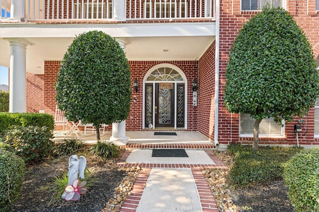 18226 Ennsbury Dr, Houston, TX 77084 - property entrance featuring brick siding, a balcony, and a porch