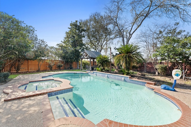 18226 Ennsbury Dr, Houston, TX 77084 - view of pool with a gazebo, a fenced backyard, and a pool with connected hot tub