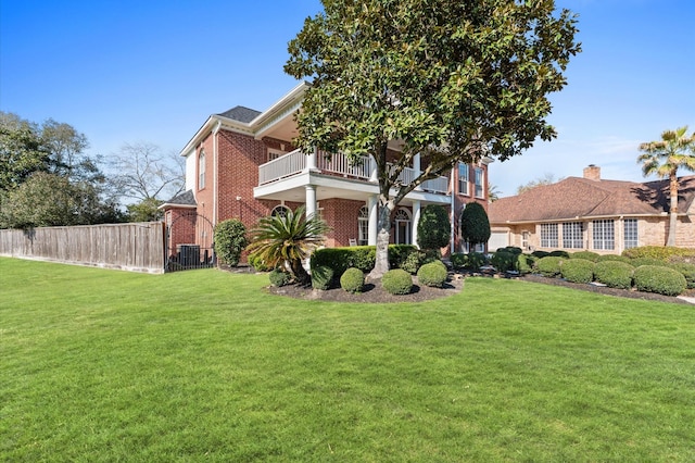 18226 Ennsbury Dr, Houston, TX 77084 - view of front facade with a balcony, brick siding, and cooling unit