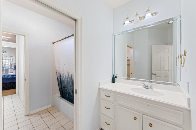 18226 Ennsbury Dr, Houston, TX 77084 - bathroom with vanity, tile patterned floors, shower / bath combo with shower curtain, and baseboards