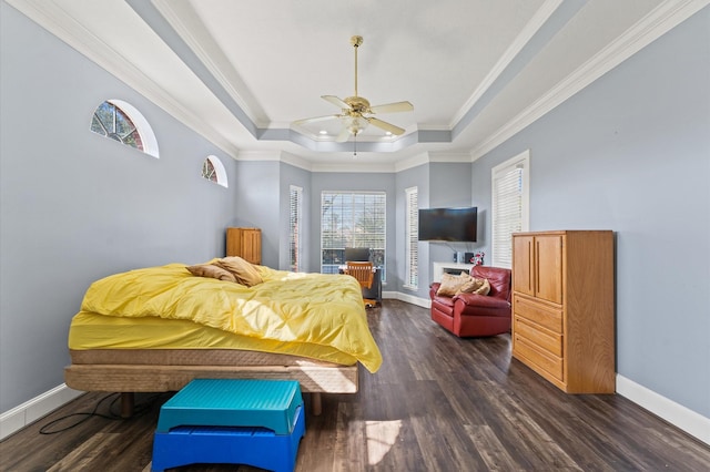 18226 Ennsbury Dr, Houston, TX 77084 - bedroom featuring a tray ceiling, dark wood finished floors, baseboards, and crown molding