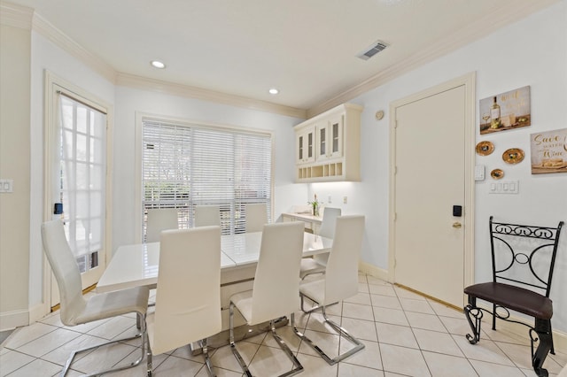 18226 Ennsbury Dr, Houston, TX 77084 - dining space featuring crown molding, baseboards, recessed lighting, and light tile patterned floors
