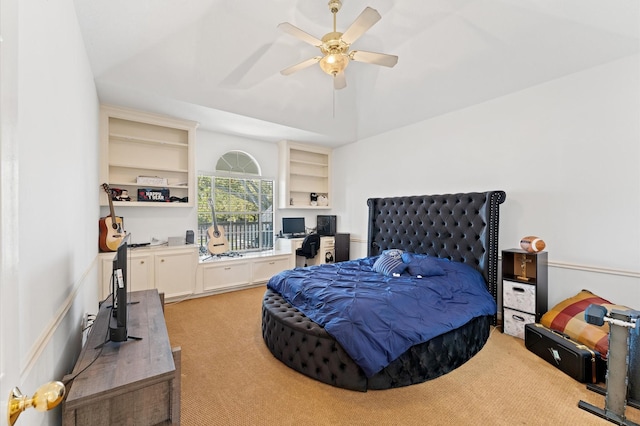 18226 Ennsbury Dr, Houston, TX 77084 - bedroom with light colored carpet, vaulted ceiling, and ceiling fan