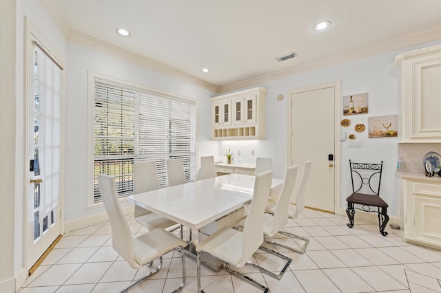 18226 Ennsbury Dr, Houston, TX 77084 - dining room with light tile patterned floors, recessed lighting, ornamental molding, and baseboards
