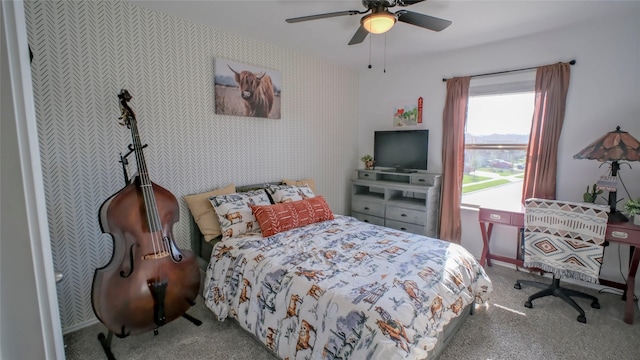 21386 Owl Rd, New Caney, TX 77357 - carpeted bedroom with wallpapered walls and ceiling fan