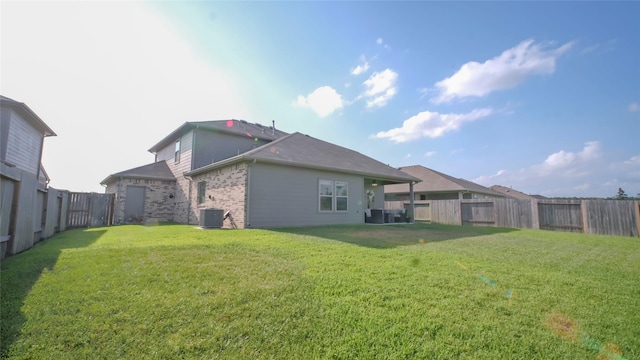 21386 Owl Rd, New Caney, TX 77357 - back of house with central AC and brick siding