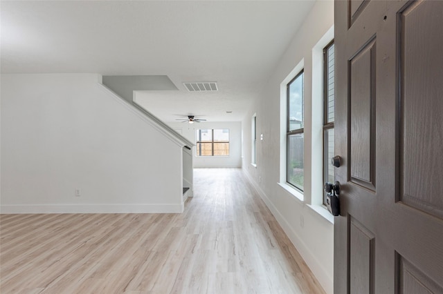 12034 Audubon Hill Ct, Houston, TX 77038 - entrance foyer with light wood-type flooring, baseboards, stairs, and ceiling fan