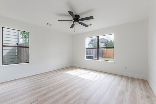 12034 Audubon Hill Ct, Houston, TX 77038 - unfurnished room with light wood-style floors, baseboards, and a ceiling fan