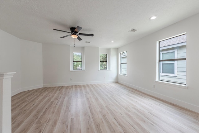 12034 Audubon Hill Ct, Houston, TX 77038 - unfurnished room with light wood-style floors, a textured ceiling, baseboards, ceiling fan, and recessed lighting