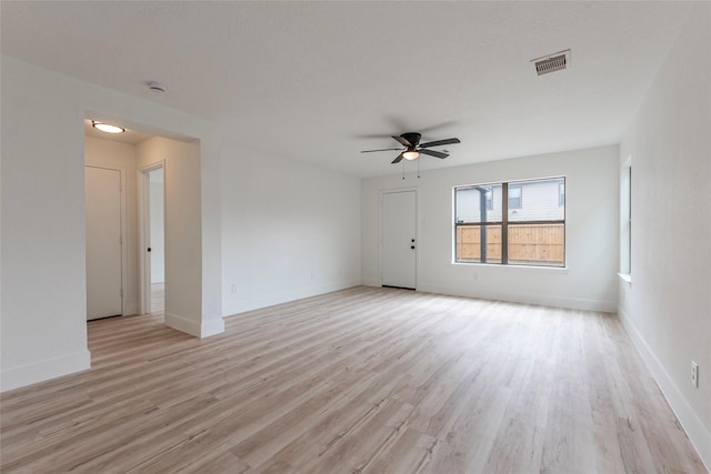 12034 Audubon Hill Ct, Houston, TX 77038 - empty room featuring ceiling fan, light wood finished floors, and baseboards