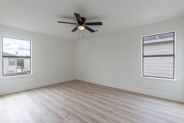 12034 Audubon Hill Ct, Houston, TX 77038 - empty room with light wood-style flooring, baseboards, and a ceiling fan