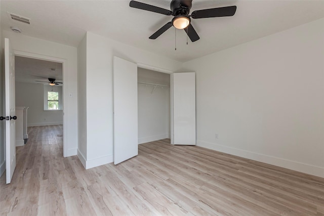 12034 Audubon Hill Ct, Houston, TX 77038 - unfurnished bedroom featuring light wood finished floors, baseboards, a closet, and ceiling fan