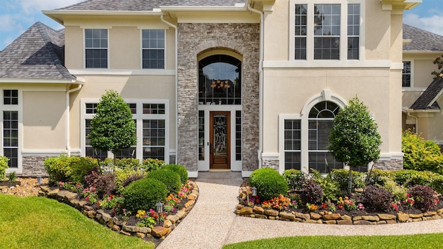 5811 Cimmaron Creek Ct, Spring, TX 77379 - entrance to property featuring stone siding, stucco siding, and a shingled roof