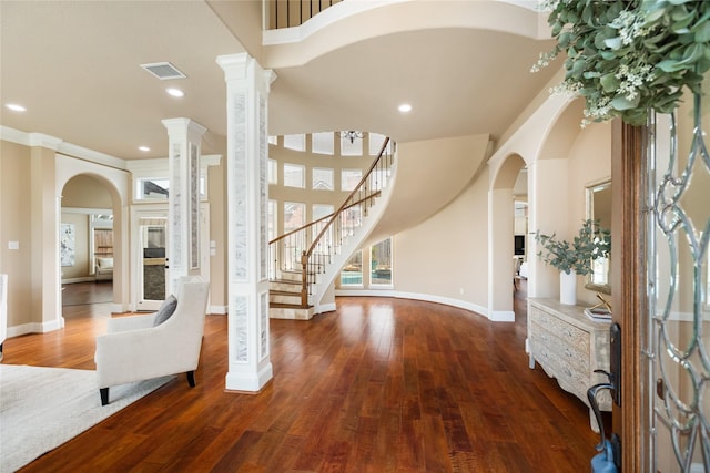 5811 Cimmaron Creek Ct, Spring, TX 77379 - entrance foyer featuring arched walkways, stairway, baseboards, wood finished floors, and recessed lighting