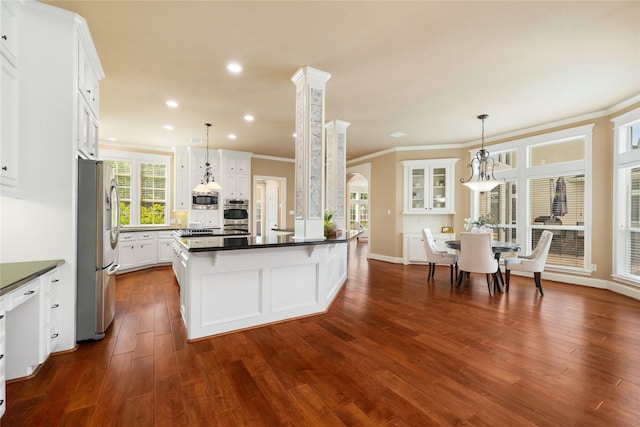 5811 Cimmaron Creek Ct, Spring, TX 77379 - kitchen with appliances with stainless steel finishes, dark countertops, white cabinetry, dark wood-type flooring, and recessed lighting