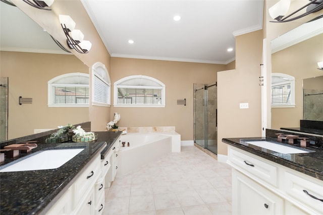 5811 Cimmaron Creek Ct, Spring, TX 77379 - full bath with a shower stall, two vanities, a garden tub, ornamental molding, and recessed lighting