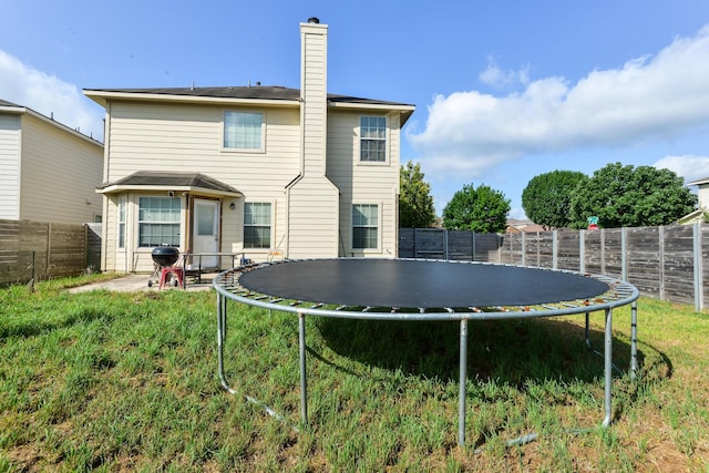 8000 Tee Dr, Austin, TX 78747 - back of property featuring a trampoline and a chimney