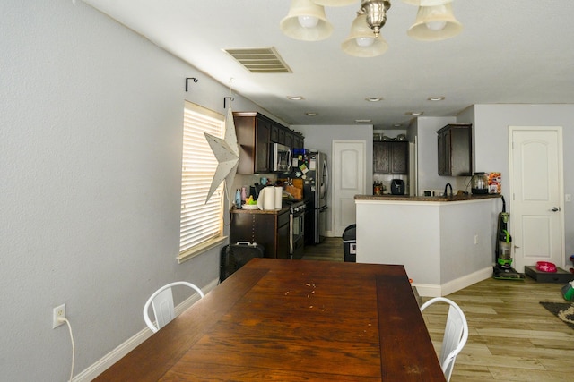 8000 Tee Dr, Austin, TX 78747 - dining room featuring light wood-style flooring and baseboards