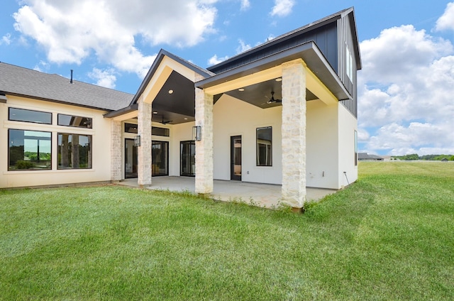 20218 Tealpointe Ridge Ln, Tomball, TX 77377 - rear view of property with a ceiling fan, a patio, a yard, and stone siding