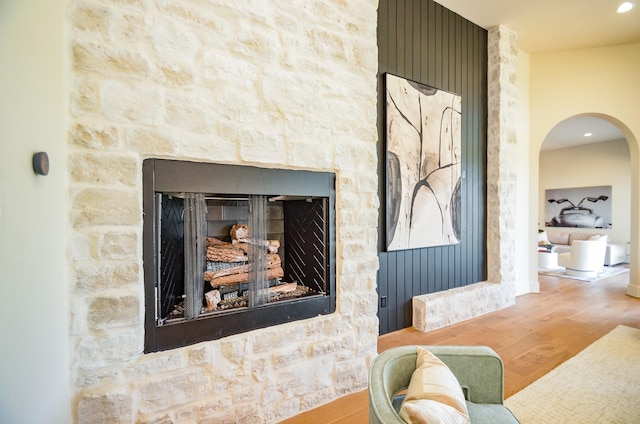 20218 Tealpointe Ridge Ln, Tomball, TX 77377 - detailed view of wood finished floors, a fireplace, and arched walkways