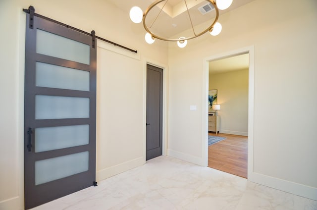 20218 Tealpointe Ridge Ln, Tomball, TX 77377 - unfurnished room with a barn door and marble look tile flooring