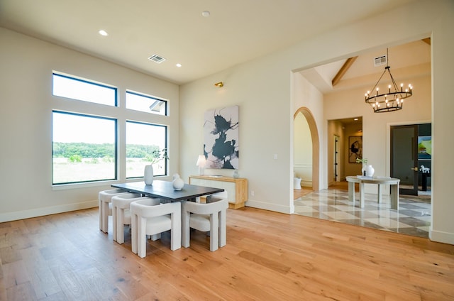 20218 Tealpointe Ridge Ln, Tomball, TX 77377 - dining room with light wood-type flooring, healthy amount of natural light, recessed lighting, a chandelier, and a towering ceiling