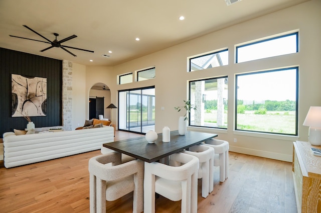20218 Tealpointe Ridge Ln, Tomball, TX 77377 - dining space with recessed lighting, light wood-style flooring, arched walkways, a ceiling fan, and an accent wall