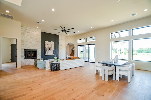 20218 Tealpointe Ridge Ln, Tomball, TX 77377 - living room with arched walkways, plenty of natural light, recessed lighting, and light wood finished floors
