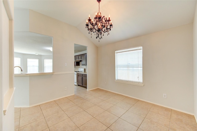 19814 Lindenfield Pl, Katy, TX 77449 - unfurnished room with a chandelier, plenty of natural light, vaulted ceiling, light tile patterned floors, and baseboards