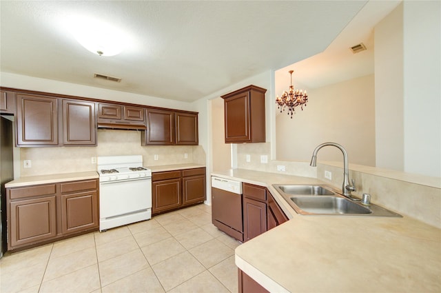 19814 Lindenfield Pl, Katy, TX 77449 - kitchen featuring white gas range oven, dishwasher, a sink, under cabinet range hood, and a chandelier