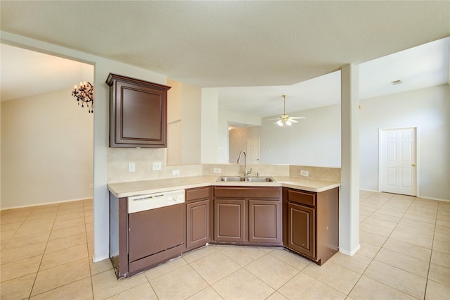 19814 Lindenfield Pl, Katy, TX 77449 - kitchen featuring dishwashing machine, a sink, light tile patterned flooring, and light countertops