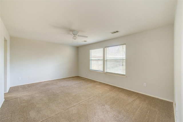 19814 Lindenfield Pl, Katy, TX 77449 - spare room with light colored carpet, ceiling fan, and baseboards