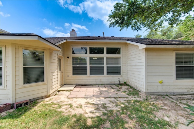 19814 Lindenfield Pl, Katy, TX 77449 - rear view of house featuring a patio and a chimney