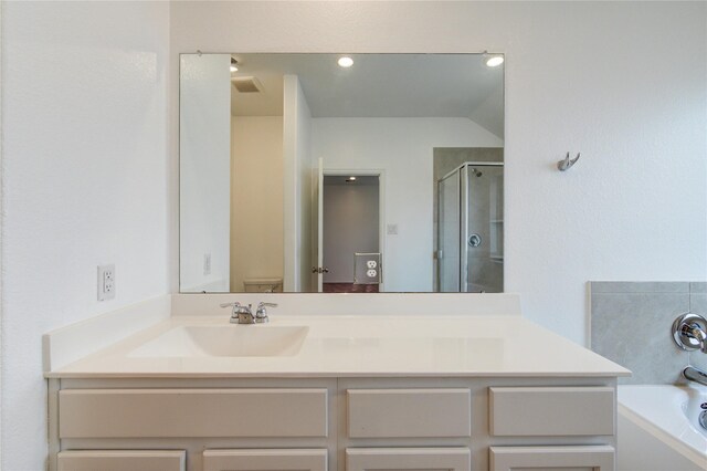 22619 Malvicino Dr, New Caney, TX 77357 - full bathroom featuring vanity, a bath, a shower stall, and toilet