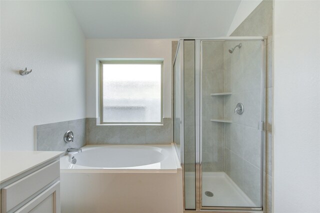 22619 Malvicino Dr, New Caney, TX 77357 - bathroom featuring a stall shower, a bath, and vanity