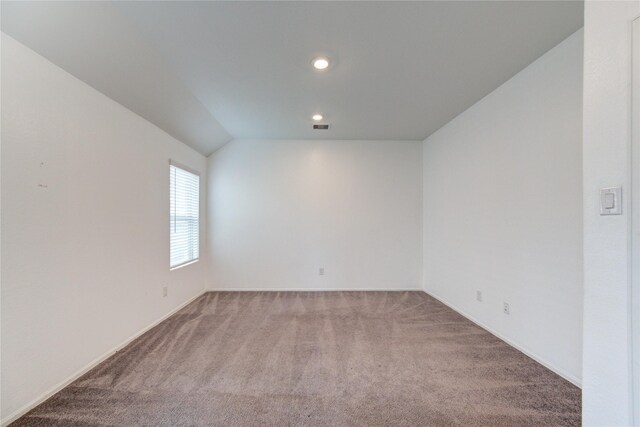 22619 Malvicino Dr, New Caney, TX 77357 - spare room featuring carpet flooring, vaulted ceiling, recessed lighting, and baseboards
