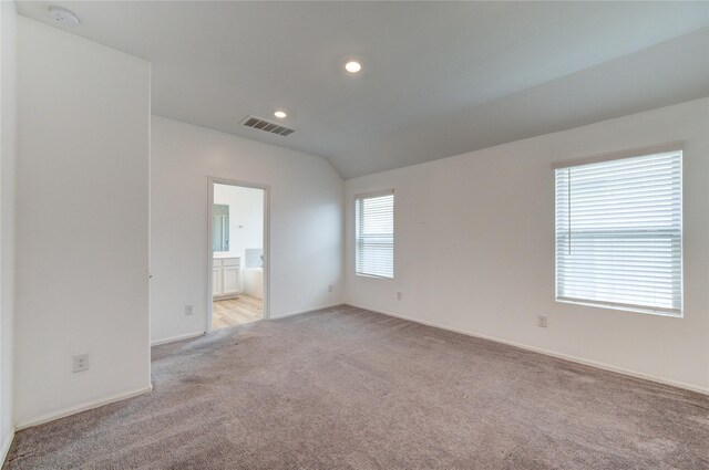 22619 Malvicino Dr, New Caney, TX 77357 - empty room with light carpet, a smoke detector, baseboards, lofted ceiling, and recessed lighting