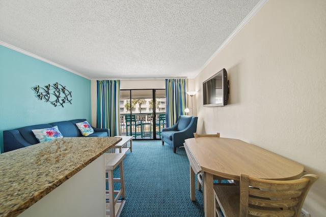 6102 Seawall Blvd Unit 175, Galveston, TX 77551 - living room featuring crown molding, carpet, and a textured ceiling